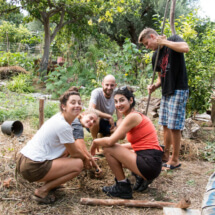 people posing while creating the mix for natural building